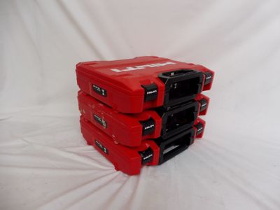 three red cases are stacked on top of each other on a white surface