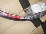 a bike tire that is wrapped in plastic on a cardboard box