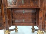 a small wooden table with a drawer on top of it
