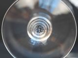 a close up view of a wine glass on a table