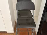 a chair that is sitting in a corner of a room