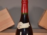 a bottle of wine that is sitting on a table