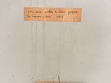 a piece of paper hanging on a wall with writing on it