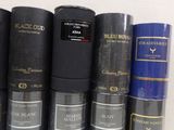 a lot of different types of perfumes on a shelf