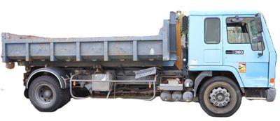 a blue dump truck that is parked on the side of the road