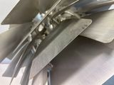 a close up of a metal object with a chain attached to it