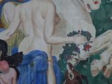 a painting on the wall of a building depicting a woman and a horse