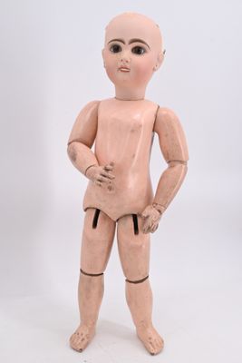 a wooden mannequin that is standing on a white surface