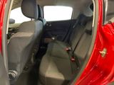 a red car with two seats in the back of it