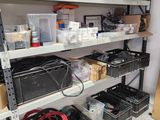 many boxes and bins on the shelves in the garage