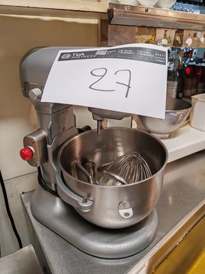 a mixer on the counter with a price tag on it