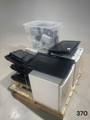 a stack of computer equipment sitting on a pallet