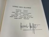a signed book with a picture of a man on it
