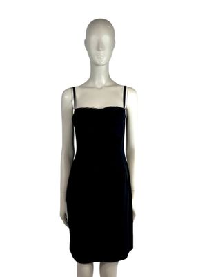 the mannequin is wearing a black dress and black heels