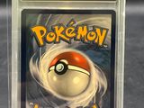 a close up of a pokemon card in a plastic case