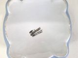 a blue and white plate with a logo on it