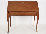 a small wooden desk with drawers and a drawer underneath it