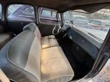 an old car that is sitting in the back of the car