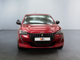 the front view of a red car in a white room