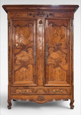 an antique wooden armoire with carvings and carvings on the doors