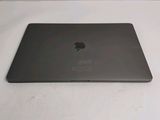 the back of an apple macbook pro laptop computer sitting on a white surface
