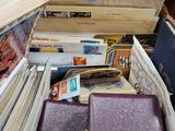 a pile of books and other items sitting on a table
