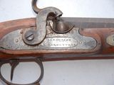 a close up of a gun that is on display