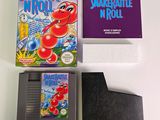 a box of nintendo games and a game card on a table