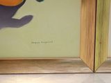 two framed pictures of a cat and an orange