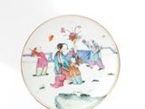 a plate with a picture of a woman and a child on it