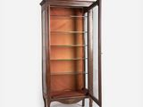 a wooden display cabinet with glass shelves and shelves in the middle