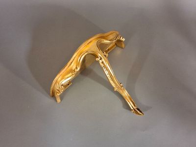 a gold colored object that is on a table