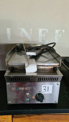 an image of a toaster sitting on top of a counter next to a toaster oven