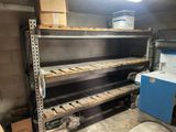 a room with a lot of shelves and boxes on the shelves