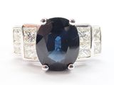 an image of a blue sapphire and diamond ring on a white background