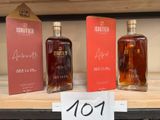 trois bouteilles d'alcool sont posées sur une étagère dans un magasin