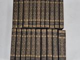 a set of twelve books with gold trimmings on them