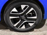 a close up of a wheel on a blue car