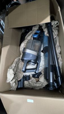 a cardboard box with a bunch of tools inside of it