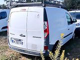 a white van that is parked in the grass