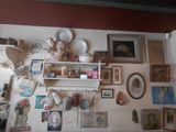 a picture of a wall with many pictures and pictures on it