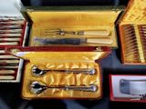 many different types of silverware in a case