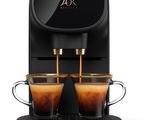 une machine à café Philips avec deux tasses de café posées devant