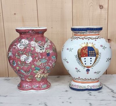 two vases sitting side by side on a table