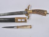 two knives and a knife holder on a white surface