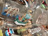 a large pile of empty glass bottles on the ground