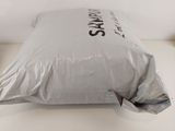 a pillow that is sitting on a bed in a room