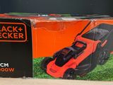 the box of a black decker lawn mower sits on a table