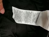 someone is holding a piece of paper that has a label on it