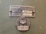 two metal tags on the back of a military vehicle